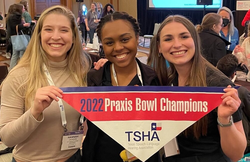 Speech-language pathology students hold champion banner for Praxis bowl