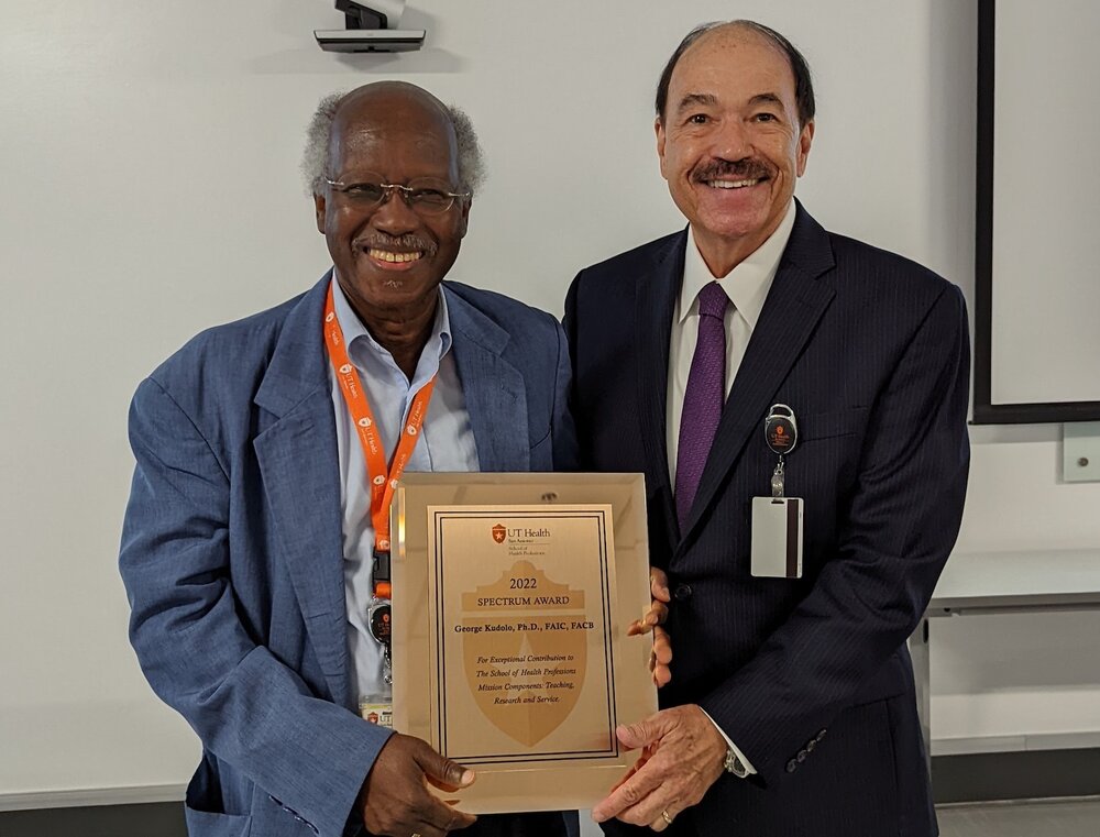 Dr. George Kudolo, on left, receives 2022 Spectrum Award