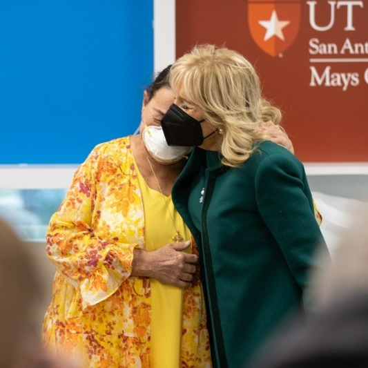 Jill Biden comforts cancer patient Rainee Miller.