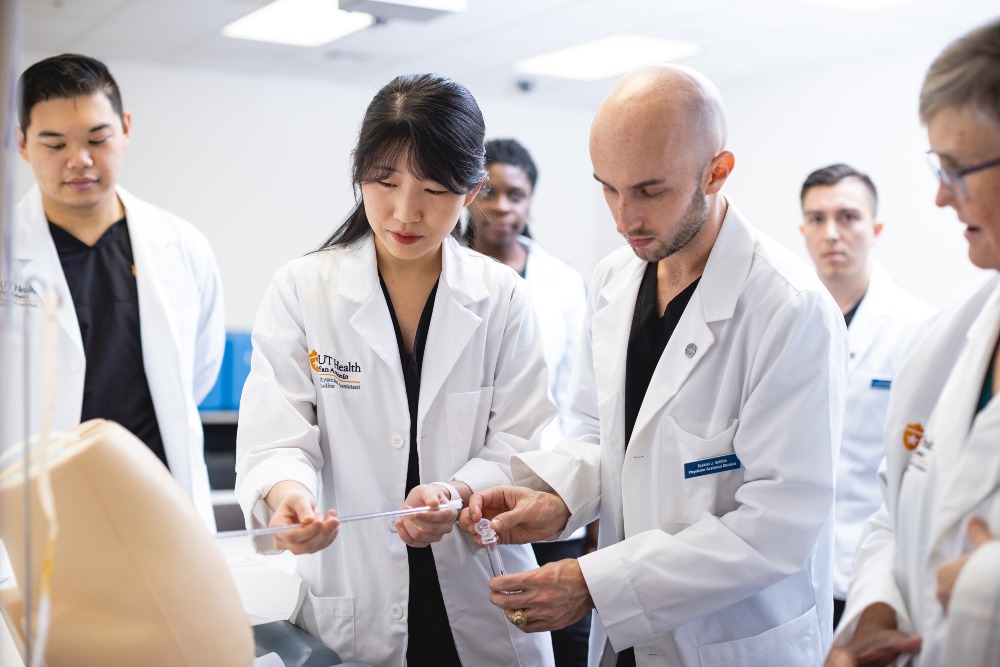 Physician assistant studies students practice clinical skills