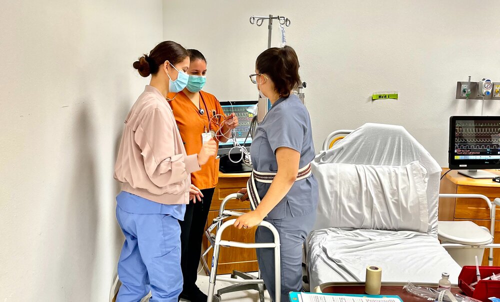 Students practice their roles in an ICU simulation activity