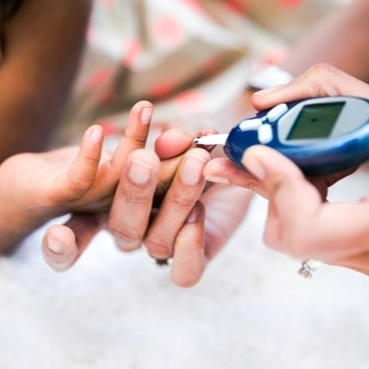 Child is checked for blood glucose levels