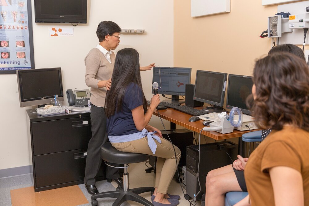 Associate Professor and Department of Communication Sciences and Disorders Chair Fang-Ling Lu works with students
